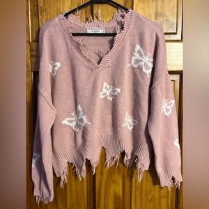 Pink sweater with butterfly